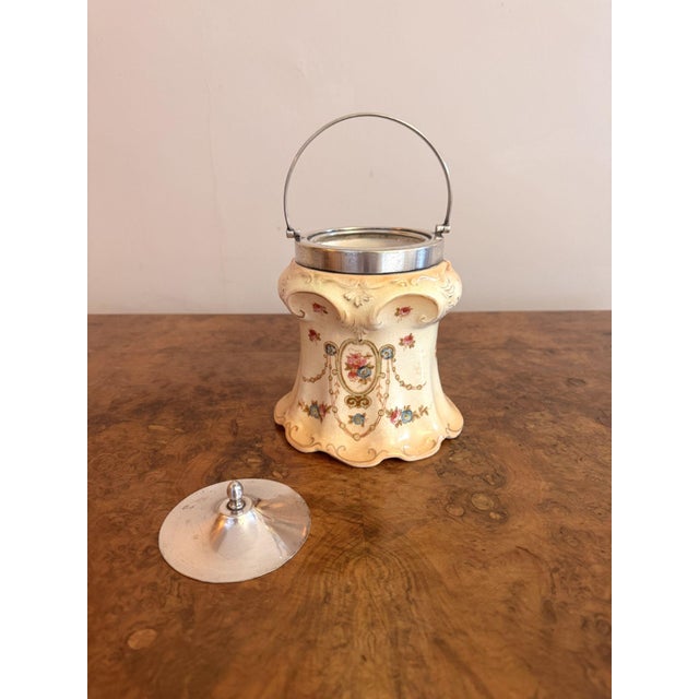 Pretty quality antique Edwardian Crown Devon biscuit barrel, having a pretty biscuit barrel decorated with flowers and...