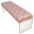 A modern bench with lucite panel supports for each side and a fully upholstered seat in a vibrant, greek key geometric...