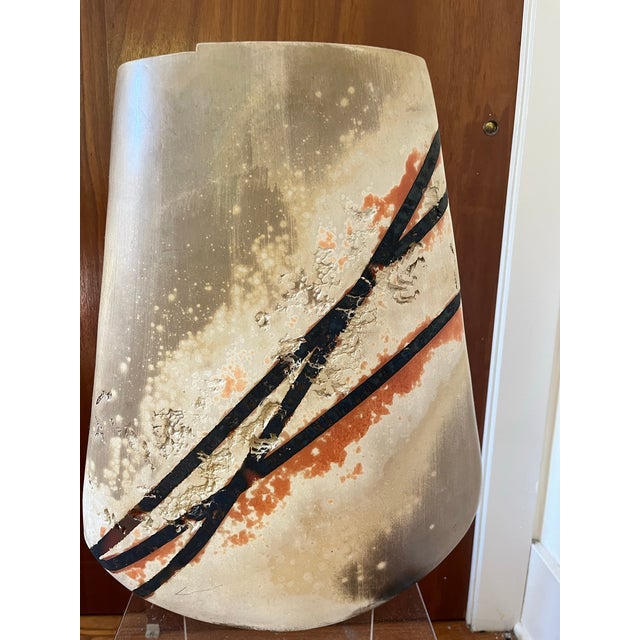 (Art Pottery from New Mexico) one-of-a-kind, hand-built ceramic form—where raw clay meets controlled chaos in a...