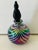 Vintage handblown iridescent Murano glass parfume bottle with topper. Decorative and collectible.
