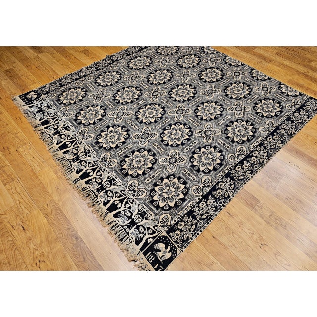 This mid-19th century American coverlet, dated 1847, is a striking example of early American textile artistry. Woven in...