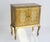 Vintage Florentine chest with two doors in golden colours with white made out of wood. The curved serpentine legs give a...