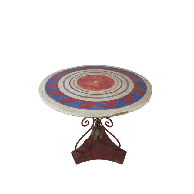 Garden table, France, circa 1900. Painted wood base with a circular painted top. The top is worked in concentric bands: a...