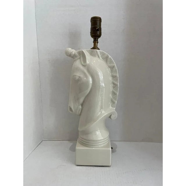 This stylish and chic table lamp captures the elegance of the Art Deco and Hollywood Regency periods with its form and use...