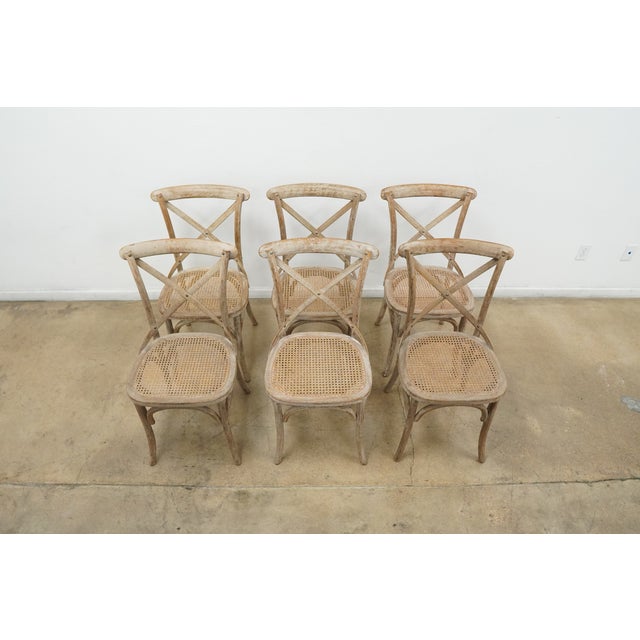 Modeled after the iconic café chairs long associated with European bistros, this X-back dining chair pays homage to the...