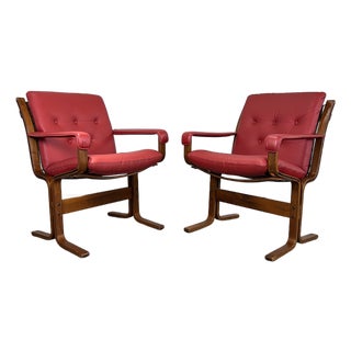 1970s Pair Red Leather/ Rosewood Framed “Siesta Arm Chairs” by Norwegian Designer Ingmar Relling for Westnofa For Sale