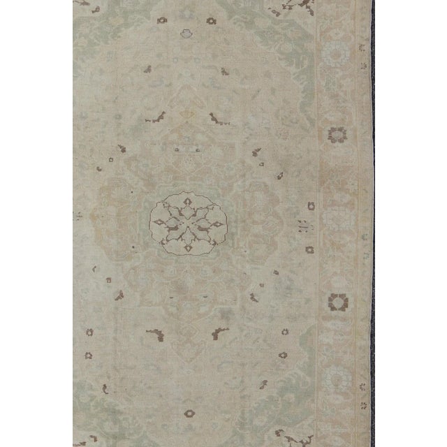 Muted Turkish Oushak rug with medallion design and floral pattern. rug , country of origin / type: Turkey / Oushak, circa...