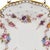 A delicate study in refinement, this Royal Crown Derby bread plate embodies the lightness and grace of English bone china....
