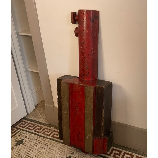 This striking antique large foundry mold features a vibrant original red finish and rich, authentic industrial character....