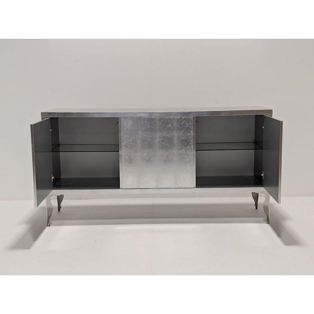 The Contemporary Silver Leaf Sideboard is a truly stunning statement for any room in the house. Striking in any setting,...