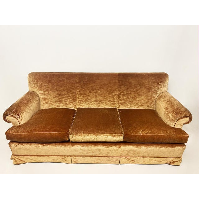 Refined Art Deco sofa with a classic frame and rounded armrests, entirely handcrafted and assembled. Upholstered in fine...