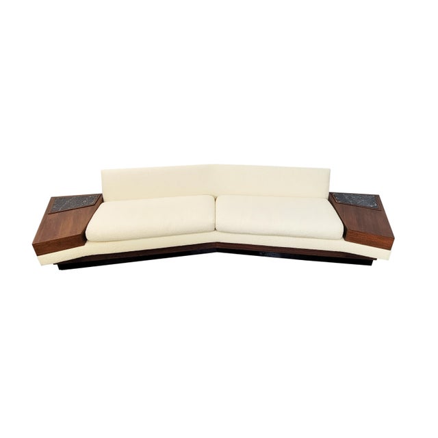 A monumental platform sofa designed by Adrian Pearsall for Craft Associates Boomerang shape Double face: the back is as...