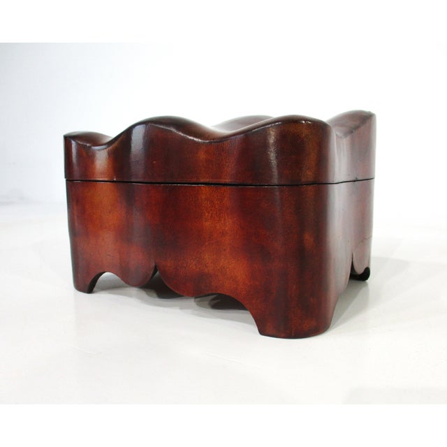 Handcrafted triple humped dark leather jewelry box with red velvet lined padded interior having a ring holder area. Making...