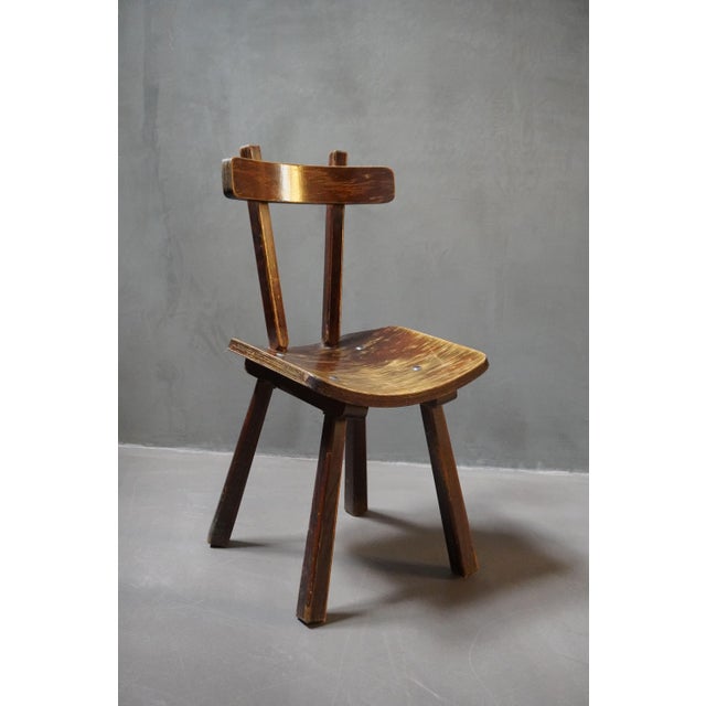 Set of 4 handcrafted French Brutalist style wooden chairs produced in the 1950s.