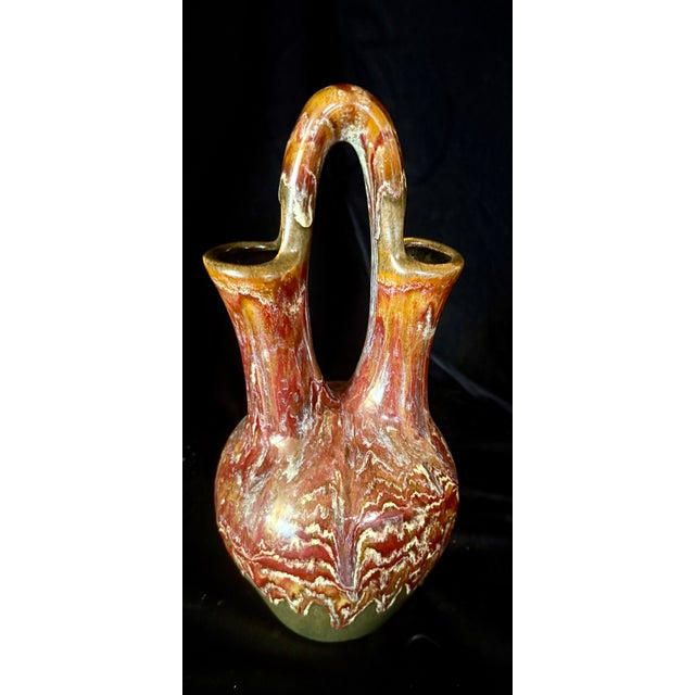 This is a handcrafted studio pottery vase created by artist Susan Hanley Peterson. The piece is authenticated by the...