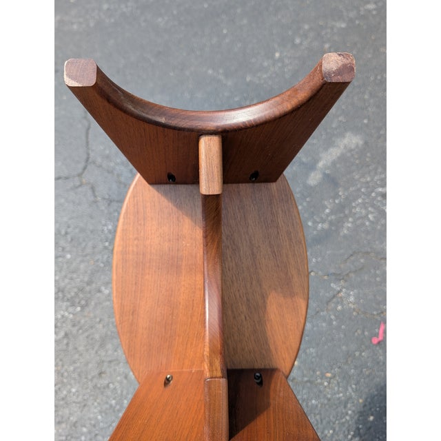 This vintage handmade cherry wood stool offers a perfect blend of rustic warmth and functional charm, making it a...