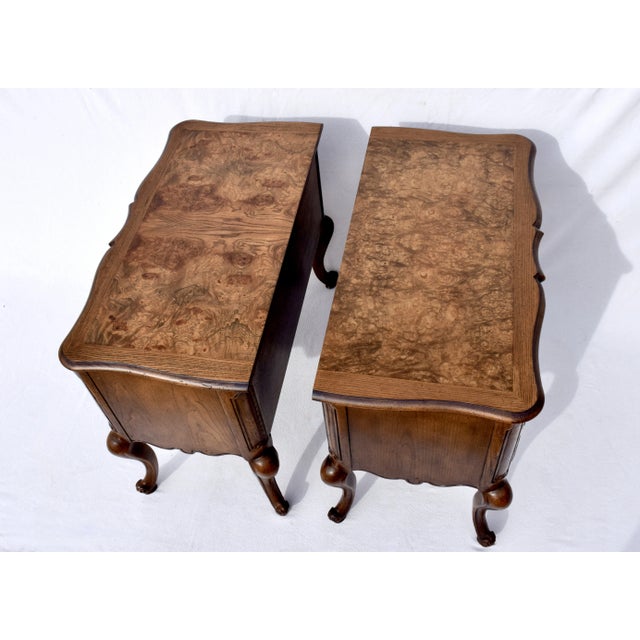 Exceptional pair of French Louis XV style serpentine Demi- commodes, nightstands or chests of drawers boasting fiery Tiger...