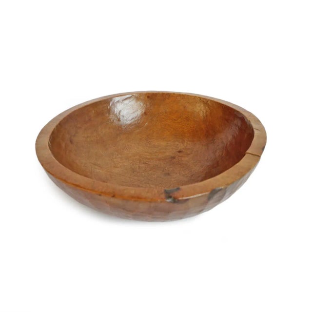 Old vintage handmade teak wood bowl from Nepal. Striking texture and natural honey finish with signs of age and use.