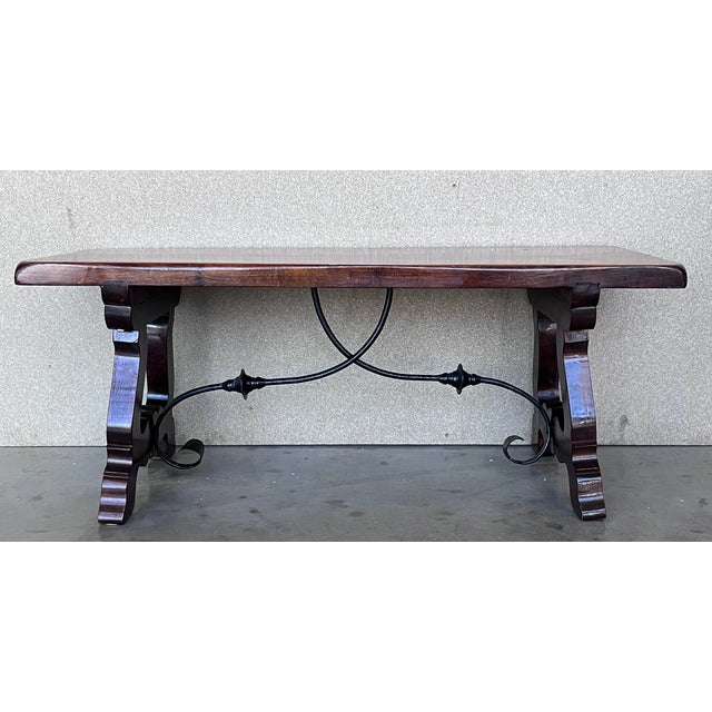 20th Century Spanish farm table with wood columns stretchers and beautiful top. An unusual form with nice shiny patina....