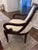 Elegant pair of custom-made transitional accent chairs featuring sculptural scroll arms, rich dark mahogany-tone wood...