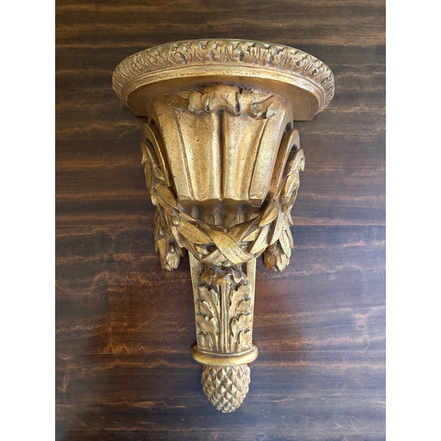 An exceptional pair of Italian neoclassical wall sconce shelves by Borghese, richly carved with foliate swags, fluted...