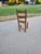 A wonderful example of early-to-mid 20th-century primitive folk art craftsmanship. This children's ladder-back chair...