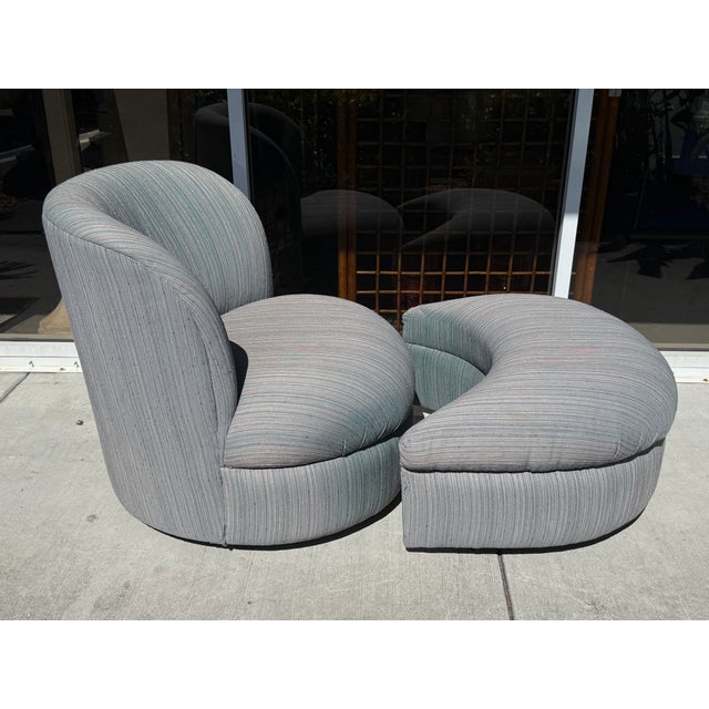 Art Deco/Postmodern style chair and a matching crescent-shaped ottoman. This specific set is highly characteristic of...