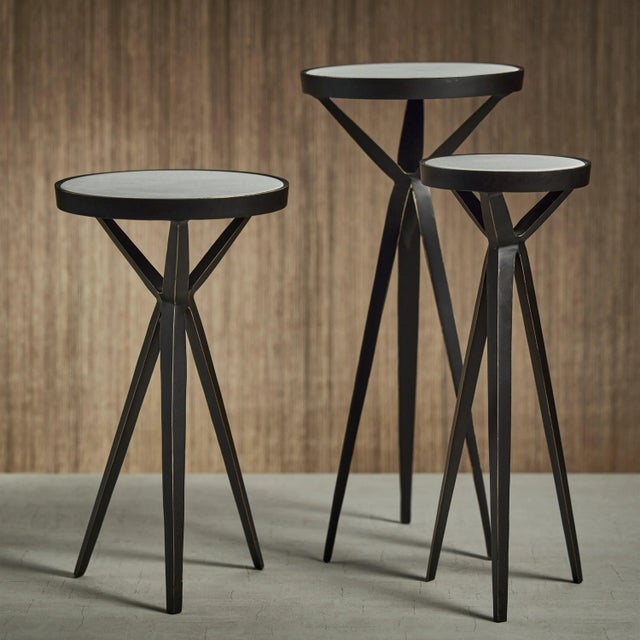 The ultimate in cocktail table chic, this table is made of durable aluminum and features a marble top. With a polished...
