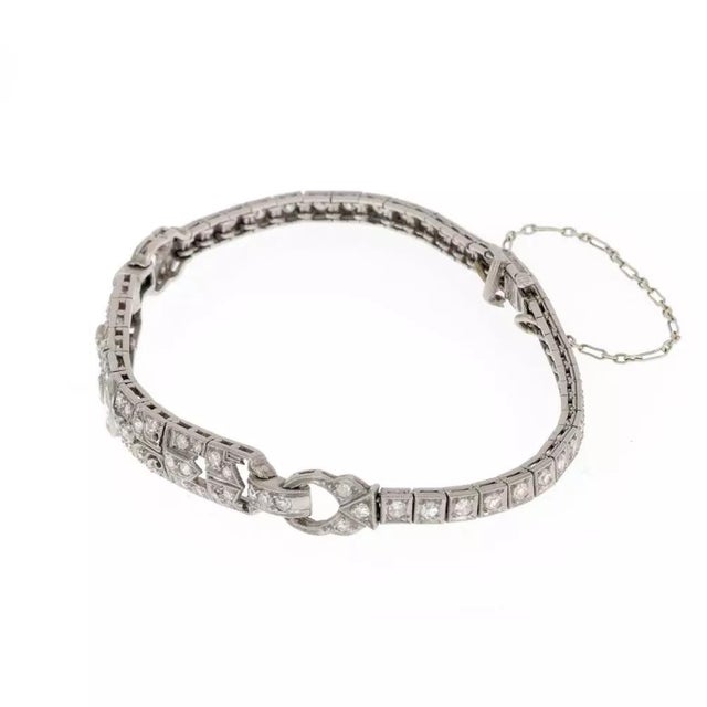 This beautiful Art Deco bracelet is crafted from platinum. The 2.5 inches long centerpiece is 6.5mm wide with an open...