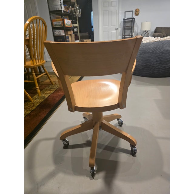 This bentwood swivel chair was produced by Antonio Calligaris, an Italian furniture manufacturer founded in 1923 in...