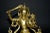 A beautiful, brightly gilded bronze statue of Tibetan Bodhisattva Manjushree. Seated in vajrasana on double lotus base,...
