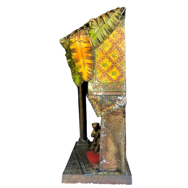 On offer is an early 20th-century "After Bergman" cold-painted spelter lamp, one that explicitly bears a stamp, likely for...