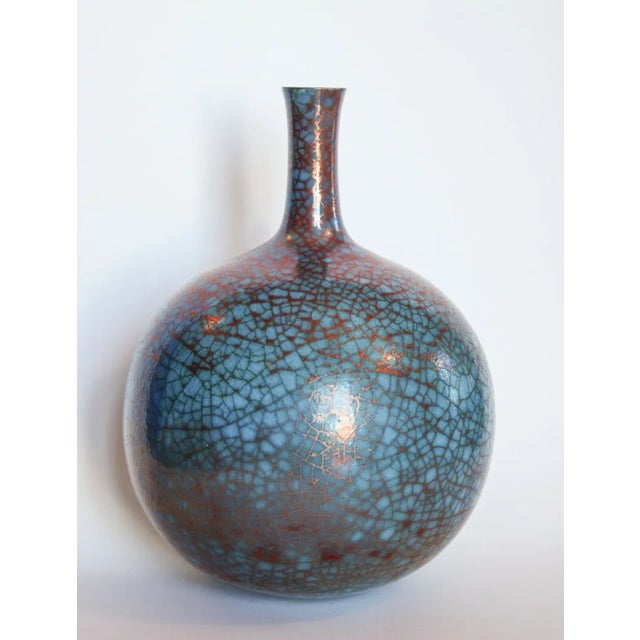 Spherical stoneware vase created by the artist Carlo Zauli in the 1970s. Sculpture, blue colour. Signed under the base as...