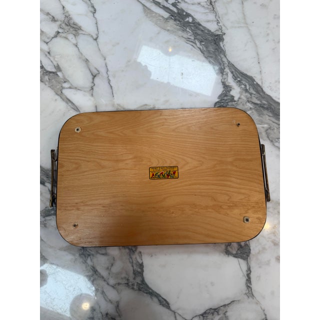 Striking vintage serving tray by Arlecchino of Milan, Italy, featuring a vibrant high-gloss red melamine surface framed by...