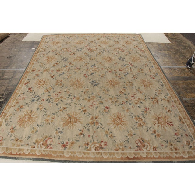 Rug & Kilim pays tribute to the celebrated French Aubusson style through this 9x13 flat weave rug from its coveted...