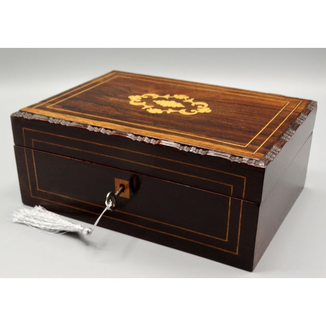 Fine quality mid-19th-Century English Rosewood box with boxwood stringing and inlay. It is handcrafted and has a lock and...