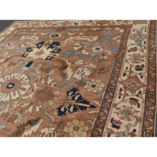 Measures: 11'8 x 13'8 Antique Persian Serapi Rug with Grand Medallion and Expansive Botanical Design. Keivan Woven Arts/...