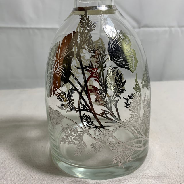 Add a touch of timeless sophistication to your bar cart or display cabinet with this stunning vintage clear glass...