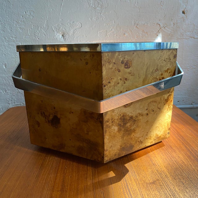 This mid-century Modernist basket is circa the 1970's. The basket is a bold, hexagonal shape wrapped in rich burl wood...