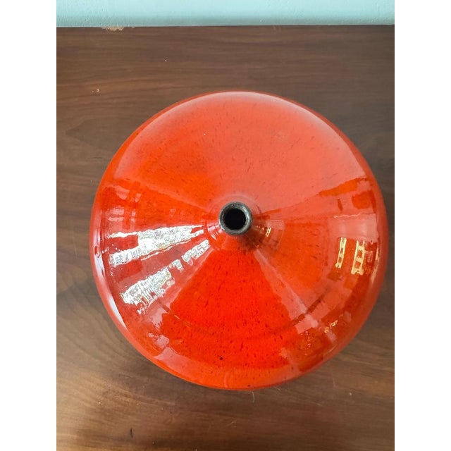 A very elegant Onion design Vase in selenium red glazed ceramic dating from circa 1960s, bearing the initials “M.K.” The...