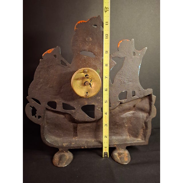 This early 20th-century cast iron mantel clock captures the height of Maritime Revival design, pairing a stylized three-...