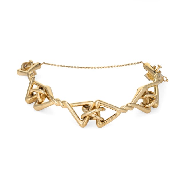 Stylish vintage Tiffany & Co bracelet crafted in 18 karat yellow gold (circa 1960s). The chunky bracelet is a Tiffany...