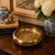 Beautiful vintage solid brass decorative bowl featuring an intricate engraved Asian landscape scene. The design depicts a...