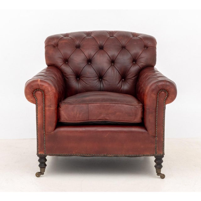 George Smith Oxblood Red Leather Upholstered Club Chair, back and arms button-tufted, brass nail trim, ebonized turned...