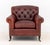George Smith Oxblood Red Leather Upholstered Club Chair, back and arms button-tufted, brass nail trim, ebonized turned...
