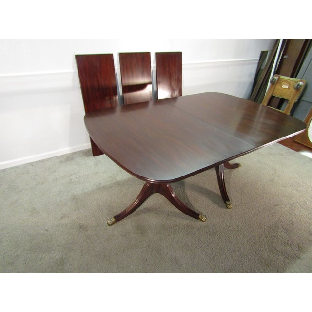 Item 88074: Henkel Harris solid mahogany dining table. Age: 2000's. Details: Comes with three leaves for expansion and...