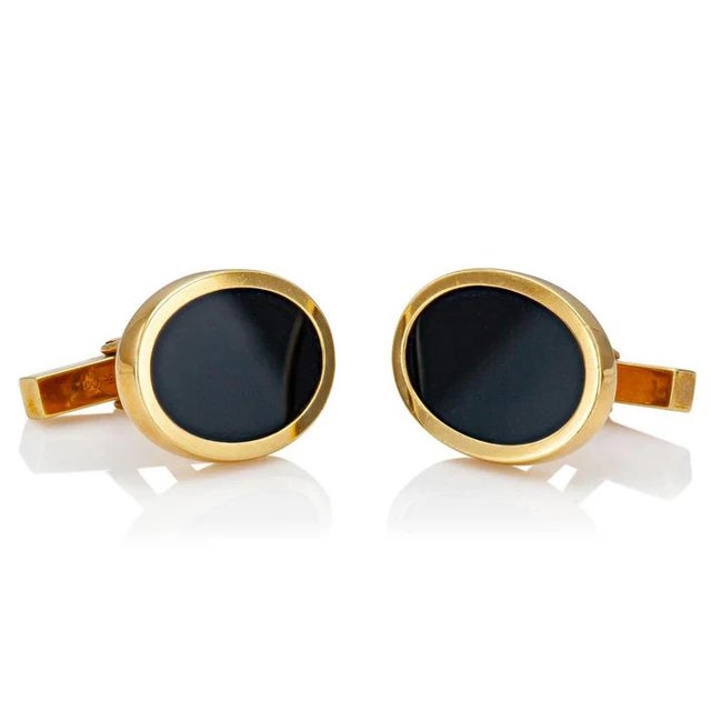18k Gold & Onyx Cufflinks by Tiffany & Co. Black onyx center. Total weight 17.3 grams.