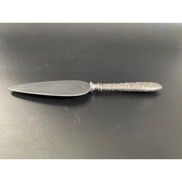 This cheese server in the Southern Rose pattern by Manchester Silver Co. features a lovely floral repoussé design on both...