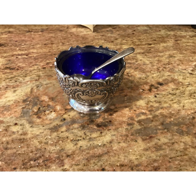 This is an elegant vintage set of 4 Silver plate salts with 2 spoons. The interior is made of royal blue glass. The set...
