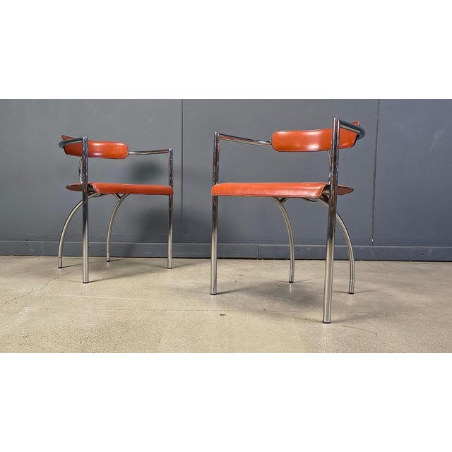 Italian post modern design dining chairs by Segis Italy made of brown/red leather seats and backrests mounted on a chromed...